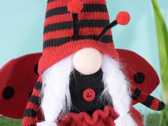 Fabric ladybug gnome with daisy to place