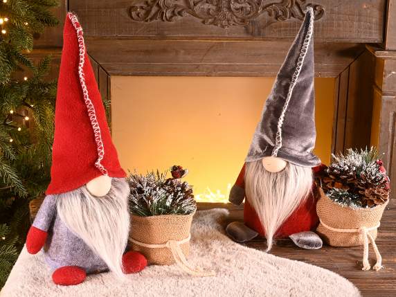 Woodland gnome with sack of snowy pine cones