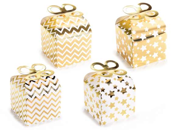 Paper box with bow closure and shiny gold-like decorations