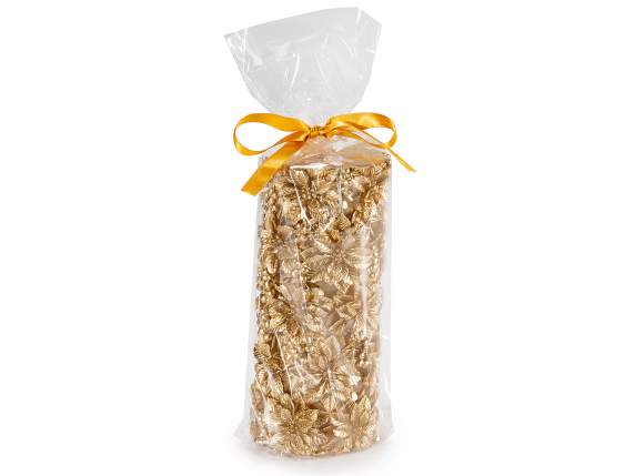 Golden candle with embossed Christmas flower decorations