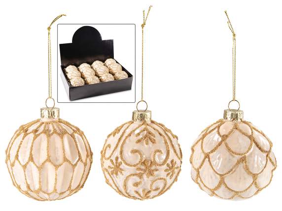 Colored glass ball with golden decorations to hang