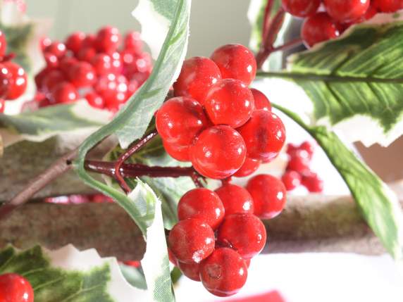 Holly branch and artificial red berries