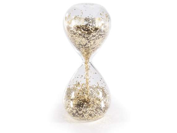 Transparent glass hourglass with golden specks