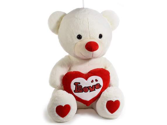 Teddy bear with stuffed heart and Love written on it