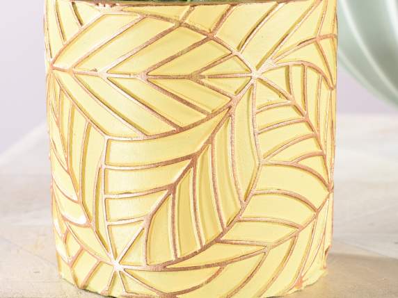 Vase in colored concrete with golden leaves in relief