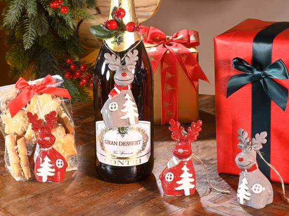 Colorful ceramic reindeer with embossed decorations to hang