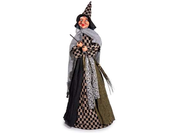 Befana Witch with cloth dress and broom to lean on