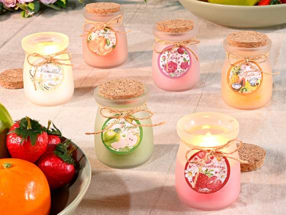 Scented candle in glass jar with cork stopper and bow