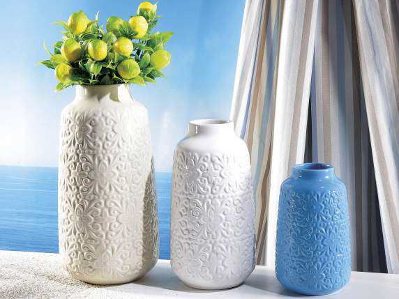 Set of 3 glossy porcelain vases with relief decorations