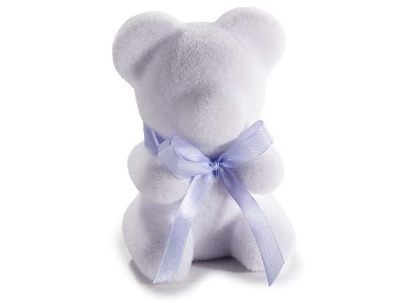 Teddy bear covered in soft velvet with bow