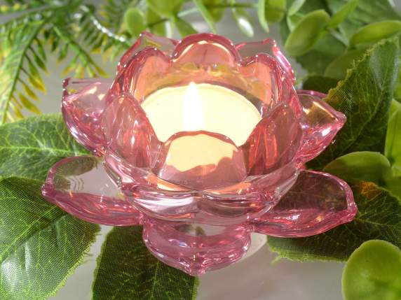 Colored glass tealight candle holder in the shape of a water
