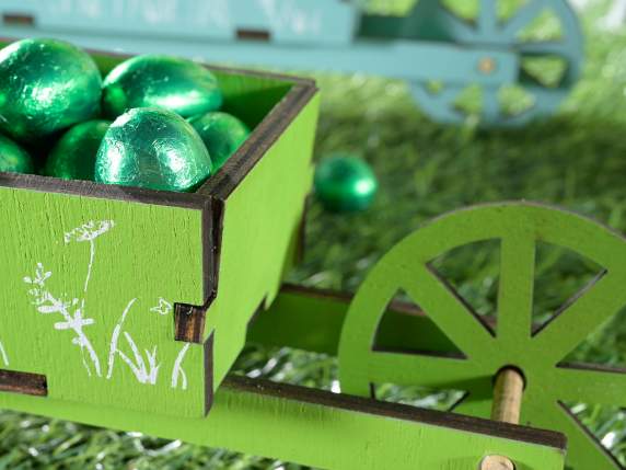 Decorative wheelbarrow in colored wood with flower decoratio