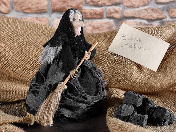 Befana - witch in cloth with a broom to lean on