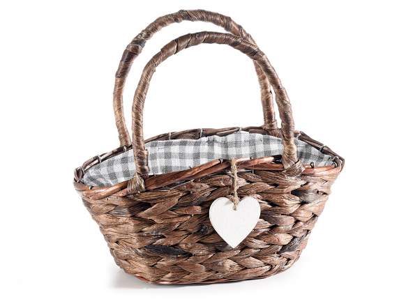Wooden basket with handles, hanging heart and checked fabric