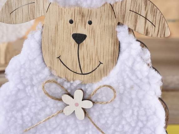Wooden sheep with soft coat and flower on a wooden base