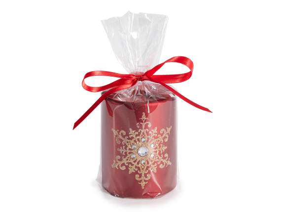 Candle with golden snowflakes and glitter