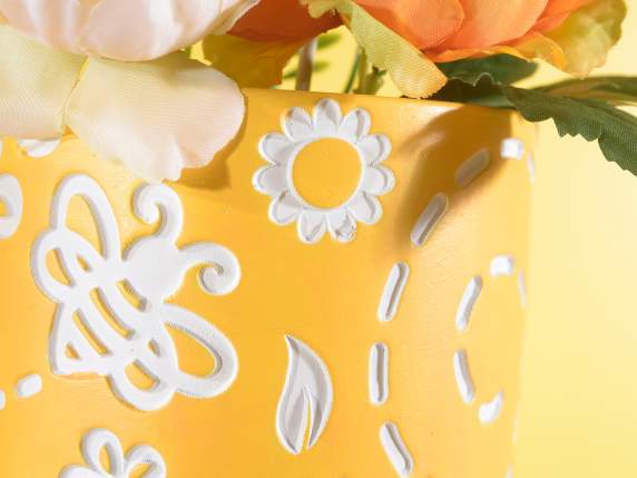 Cement vase on wooden tripod with honey decorations