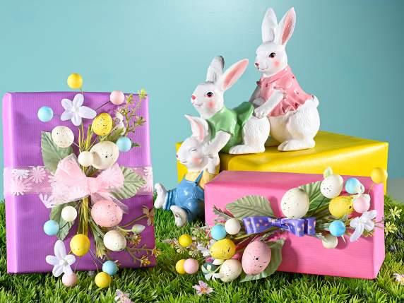 Bouquet of colored eggs and artificial flowers