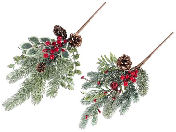 Snowy pine branch with red berries and pine cones
